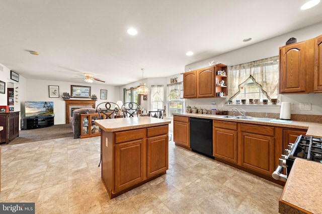 191 Willets Ave, Little Egg Harbor Twp, NJ 08087 - kitchen featuring a sink, light countertops, a ceiling fan, a tile fireplace, and black appliances