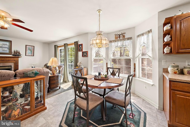 191 Willets Ave, Little Egg Harbor Twp, NJ 08087 - dining space featuring a ceiling fan, a healthy amount of sunlight, and a fireplace