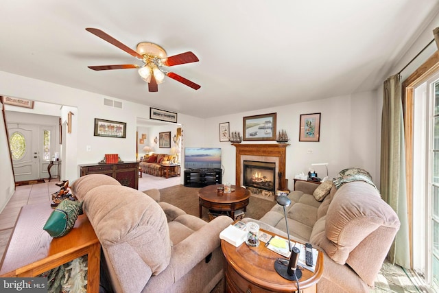 191 Willets Ave, Little Egg Harbor Twp, NJ 08087 - living room with visible vents, a ceiling fan, a glass covered fireplace, and a wealth of natural light