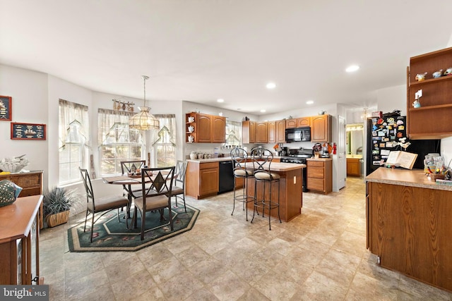 191 Willets Ave, Little Egg Harbor Twp, NJ 08087 - kitchen with a center island, open shelves, black appliances, and brown cabinets