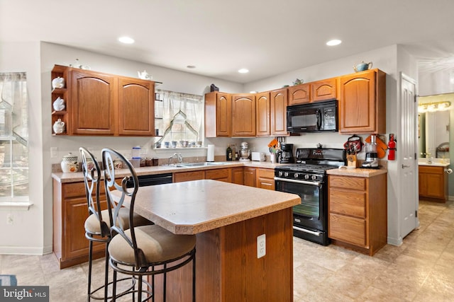 191 Willets Ave, Little Egg Harbor Twp, NJ 08087 - kitchen with a center island, light countertops, a sink, and black appliances