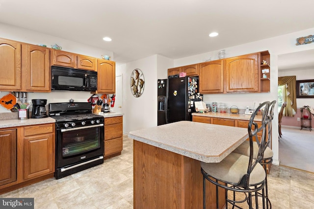 191 Willets Ave, Little Egg Harbor Twp, NJ 08087 - kitchen with light countertops, recessed lighting, a kitchen island, and black appliances