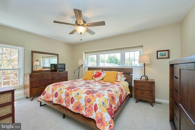 carpeted bedroom with a ceiling fan