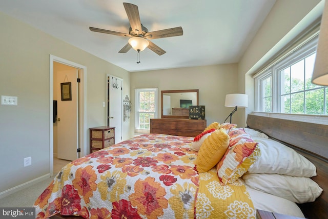 bedroom with baseboards and a ceiling fan