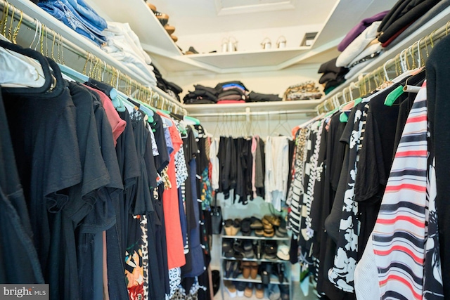 walk in closet featuring attic access