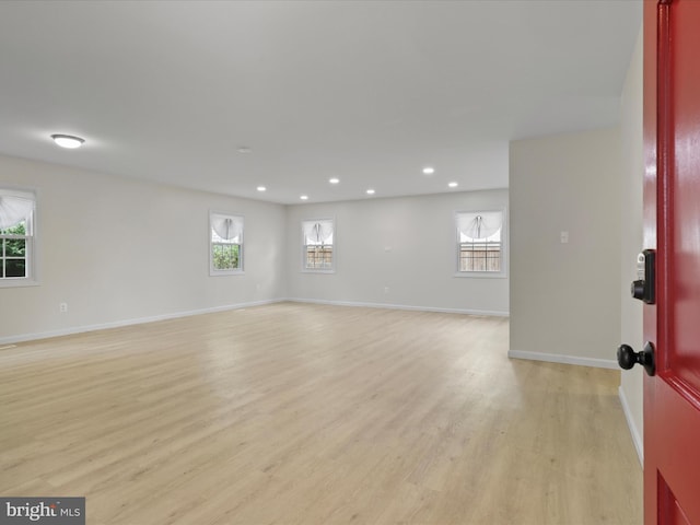 interior space featuring recessed lighting, baseboards, and light wood-type flooring