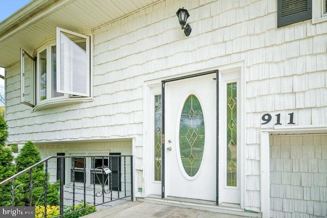 doorway to property with a garage