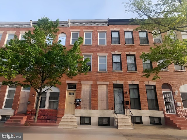 view of building exterior with entry steps