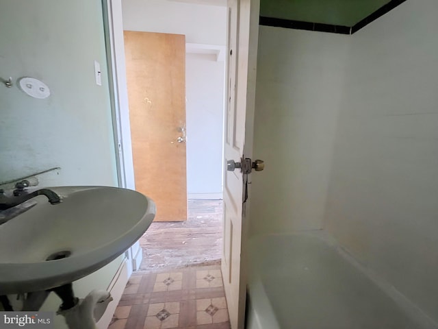 bathroom featuring a sink and tile patterned floors