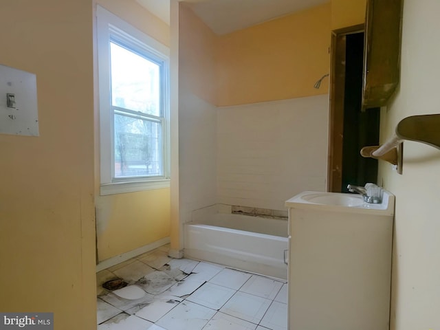 bathroom with baseboards, walk in shower, a bath, and vanity