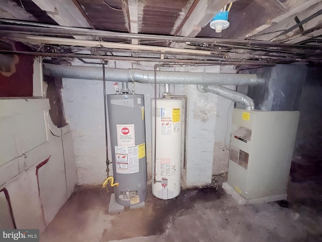 utility room featuring heating unit and water heater