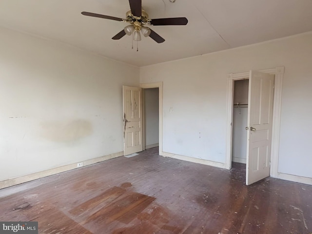 unfurnished bedroom featuring baseboards, a closet, and wood finished floors