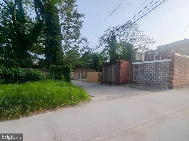 view of gate with fence