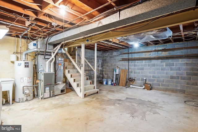 unfinished basement with stairs, heating unit, and gas water heater
