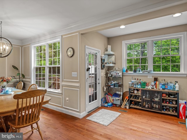 554 Wispy Branch Ln, Hedgesville, WV 25427 - dining space featuring a chandelier, ornamental molding, and wood finished floors