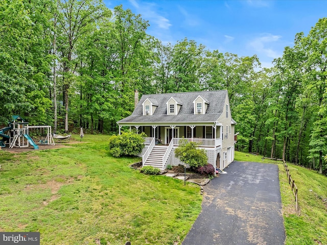 554 Wispy Branch Ln, Hedgesville, WV 25427 - cape cod house with stairs, a porch, a front lawn, driveway, and a garage