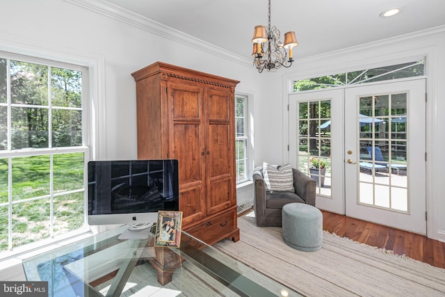 interior space with crown molding, a chandelier, french doors, recessed lighting, and wood finished floors