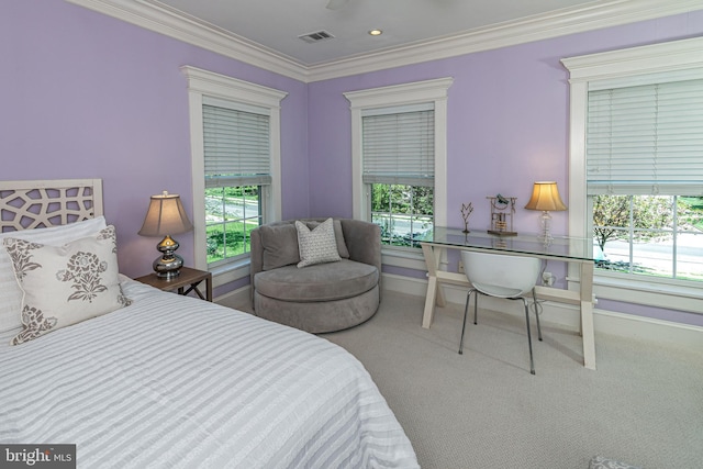 carpeted bedroom featuring crown molding, baseboards, and visible vents