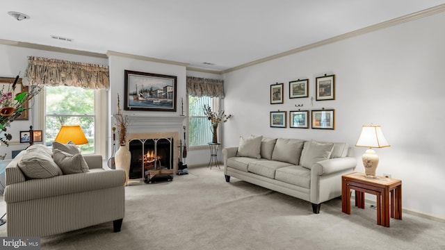 living area featuring light carpet, ornamental molding, a wealth of natural light, and visible vents
