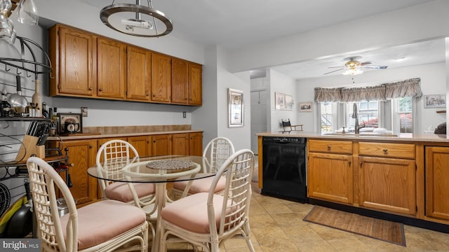 kitchen featuring a sink, brown cabinetry, a ceiling fan, and black dishwasher