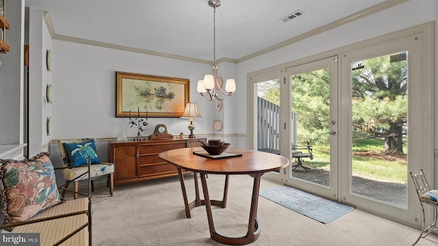 dining space with crown molding, visible vents, and light colored carpet