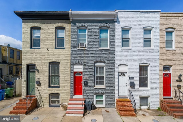 102 N Glover St, Baltimore, MD 21224 - townhome / multi-family property with stone siding and entry steps