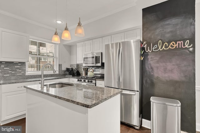 102 N Glover St, Baltimore, MD 21224 - kitchen featuring ornamental molding, dark stone counters, white cabinetry, a sink, and stainless steel appliances