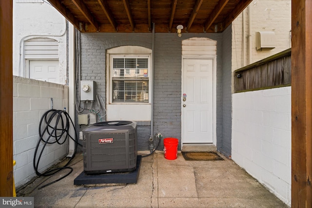 102 N Glover St, Baltimore, MD 21224 - view of exterior entry with brick siding and central AC unit
