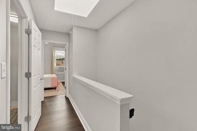 102 N Glover St, Baltimore, MD 21224 - hallway with cooling unit, attic access, baseboards, an upstairs landing, and dark wood-type flooring