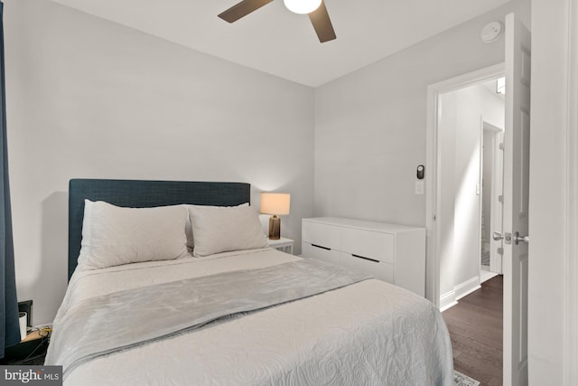 102 N Glover St, Baltimore, MD 21224 - bedroom featuring baseboards, a ceiling fan, and wood finished floors