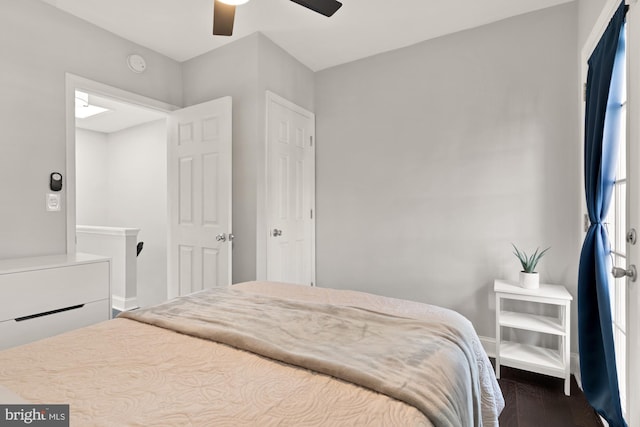 102 N Glover St, Baltimore, MD 21224 - bedroom with baseboards, a ceiling fan, and dark wood-style floors