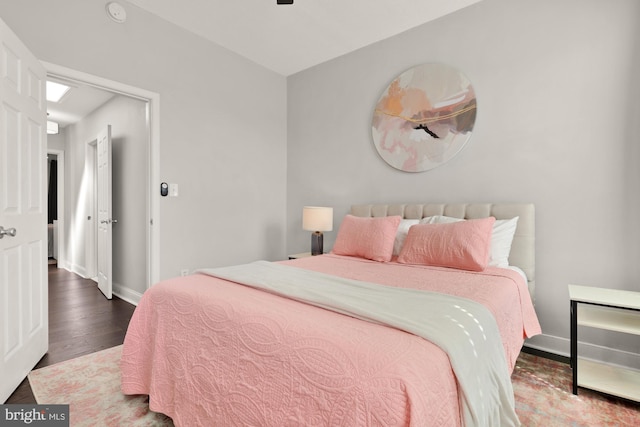 102 N Glover St, Baltimore, MD 21224 - bedroom with baseboards and wood finished floors