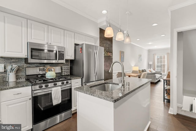 102 N Glover St, Baltimore, MD 21224 - kitchen featuring a sink, ornamental molding, backsplash, and stainless steel appliances