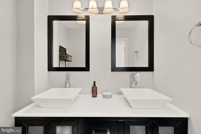 102 N Glover St, Baltimore, MD 21224 - bathroom featuring a sink and double vanity