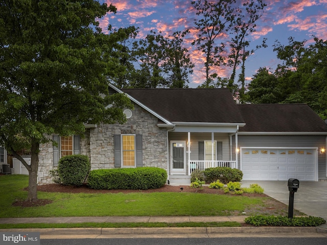 103 Potters Cir, Strasburg, VA 22657 - view of front of property featuring stone siding, a porch, driveway, a garage, and a yard