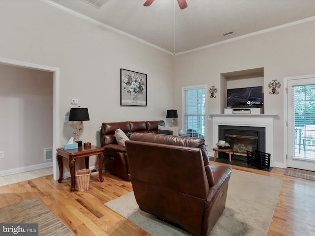 103 Potters Cir, Strasburg, VA 22657 - living room featuring wood finished floors, a fireplace with flush hearth, ceiling fan, ornamental molding, and baseboards