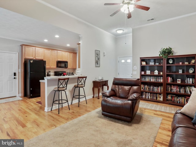 103 Potters Cir, Strasburg, VA 22657 - living room with ceiling fan, light wood finished floors, crown molding, baseboards, and recessed lighting