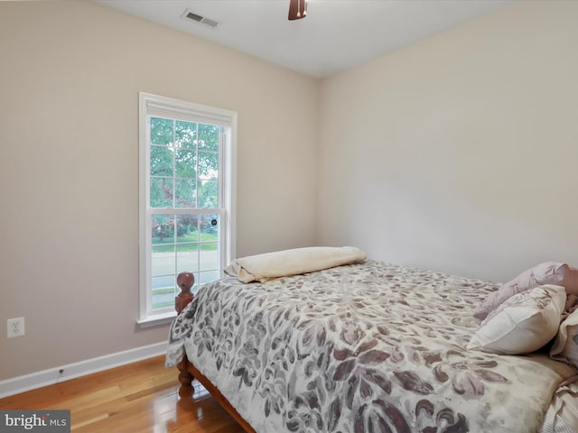 103 Potters Cir, Strasburg, VA 22657 - bedroom with light wood-style floors, multiple windows, baseboards, and a ceiling fan