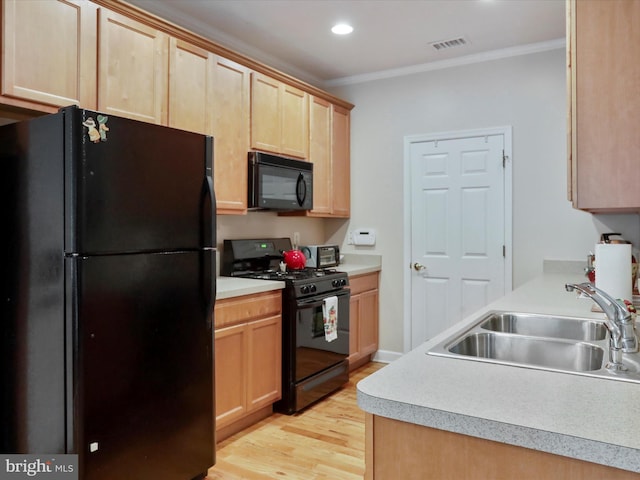 103 Potters Cir, Strasburg, VA 22657 - kitchen featuring black appliances, a sink, light brown cabinets, light wood-style floors, and crown molding