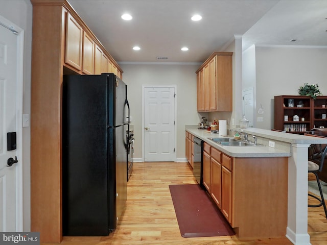 103 Potters Cir, Strasburg, VA 22657 - kitchen featuring freestanding refrigerator, a sink, a peninsula, ornamental molding, and a kitchen bar