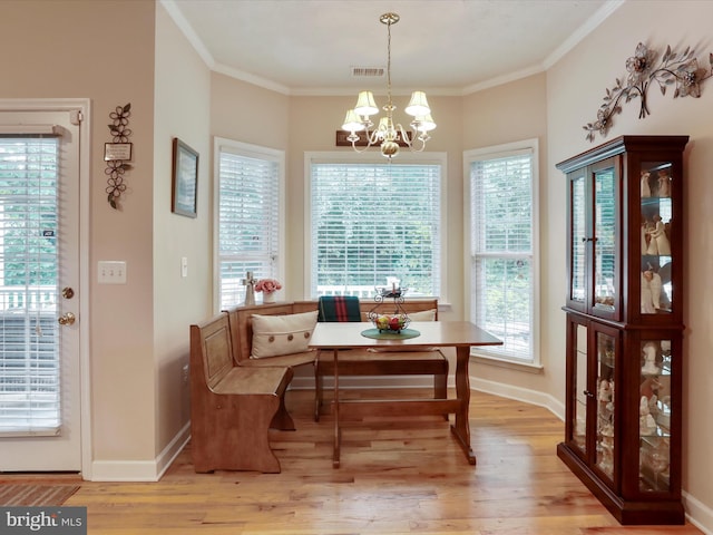 103 Potters Cir, Strasburg, VA 22657 - dining area with light wood-type flooring, a chandelier, baseboards, crown molding, and breakfast area