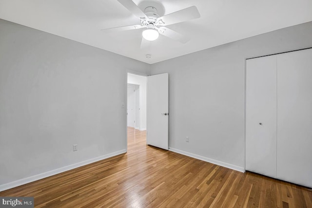 205 Dunbeath Ct, Lutherville Timonium, MD 21093 - unfurnished bedroom featuring baseboards, wood finished floors, a closet, and a ceiling fan