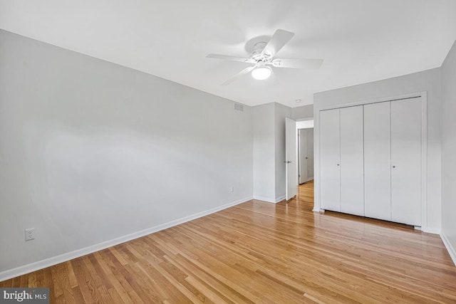 205 Dunbeath Ct, Lutherville Timonium, MD 21093 - unfurnished bedroom featuring light wood-style floors, baseboards, a closet, and a ceiling fan