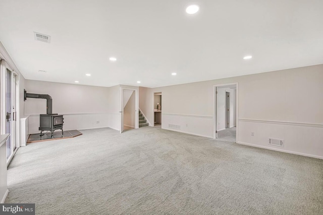 205 Dunbeath Ct, Lutherville Timonium, MD 21093 - basement with a wood stove, stairs, recessed lighting, carpet floors, and baseboards