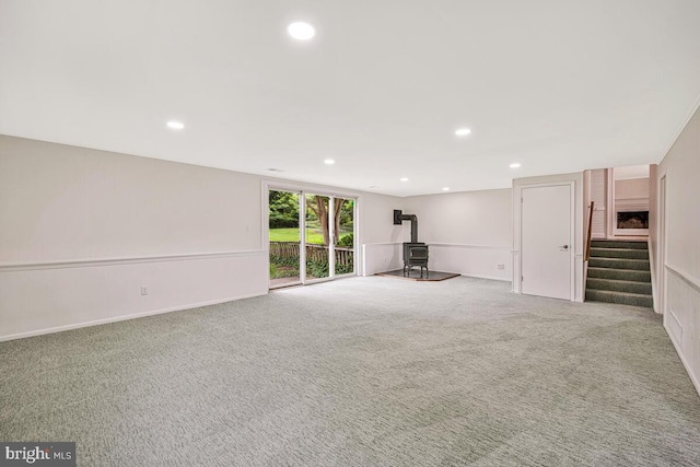 205 Dunbeath Ct, Lutherville Timonium, MD 21093 - unfurnished living room with a wood stove, recessed lighting, carpet, and stairs