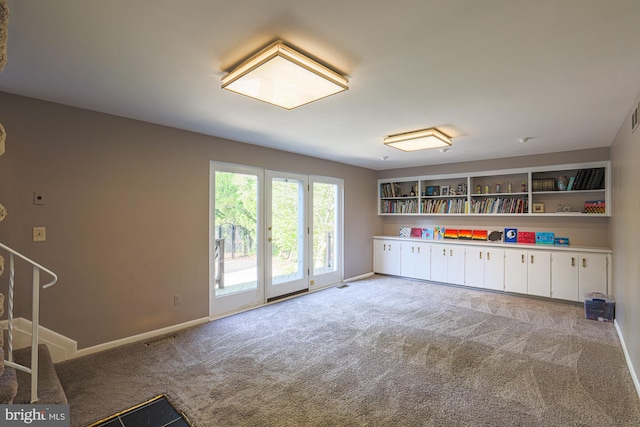 rec room with visible vents, carpet, and baseboards