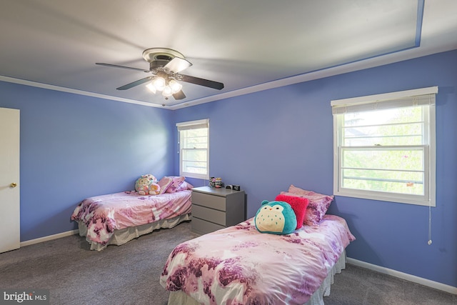 carpeted bedroom featuring baseboards and a ceiling fan