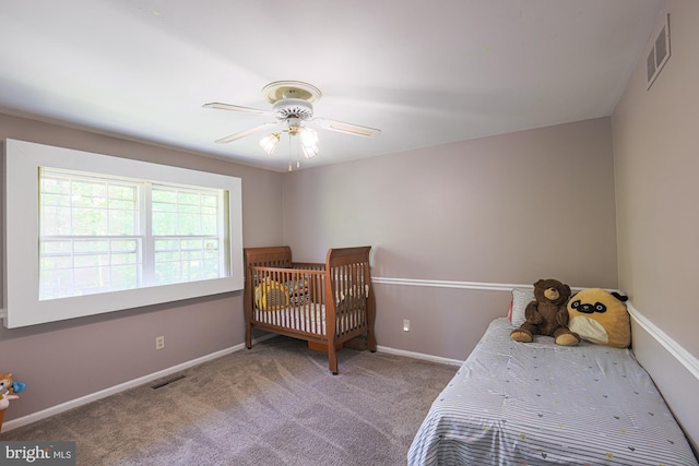 bedroom with visible vents, a ceiling fan, baseboards, and carpet floors