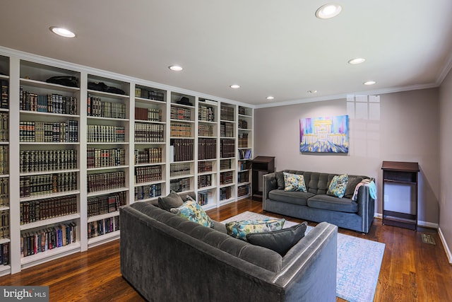 living area featuring crown molding, recessed lighting, and wood finished floors