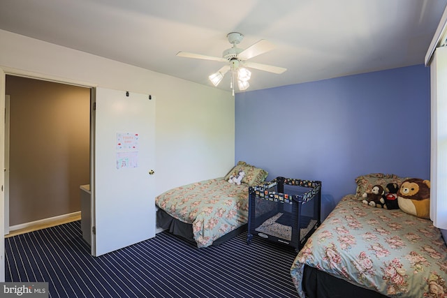 carpeted bedroom featuring a ceiling fan
